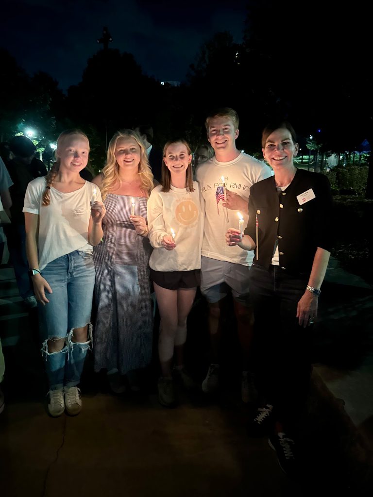 A crowd standing vigil for Charlie Kirk.