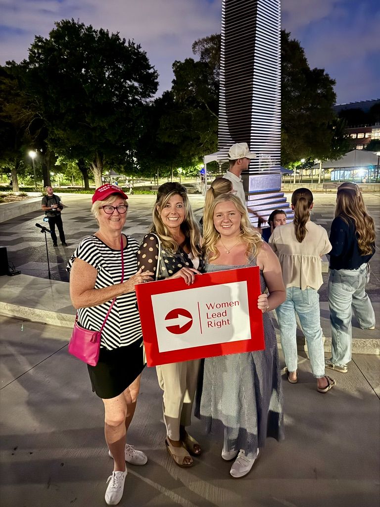 Members of Women Lead Right standing vigil for Charlie Kirk.